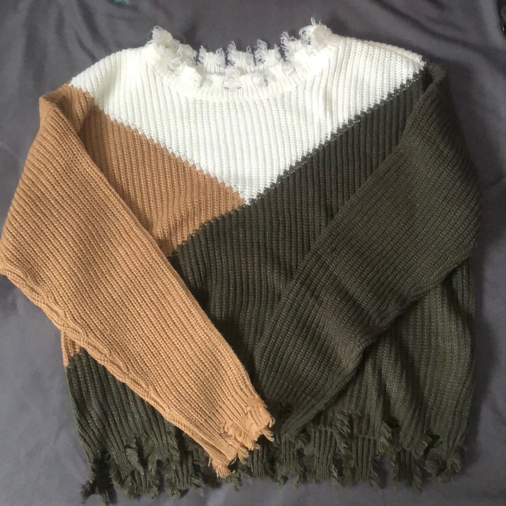 a cute fall sweater, size small, colors consist of brown, dark green, and white.